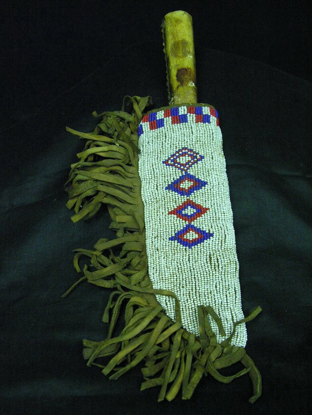 Appraisal: NATIVE AMERICAN BEADED KNIFE SHEATH Leather sheath trimmed in red