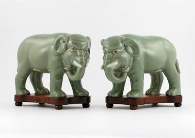 Appraisal: A pair of Chinese celadon models of elephants the pachyderms