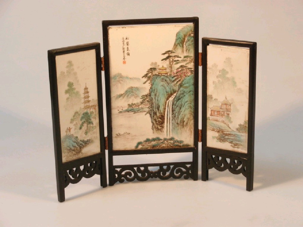 Appraisal: A Chinese porcelain table screen of three panels each painted