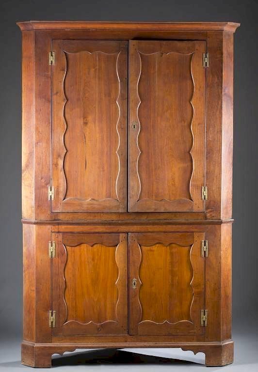 Appraisal: Early American walnut corner cabinet An American corner cabinet in