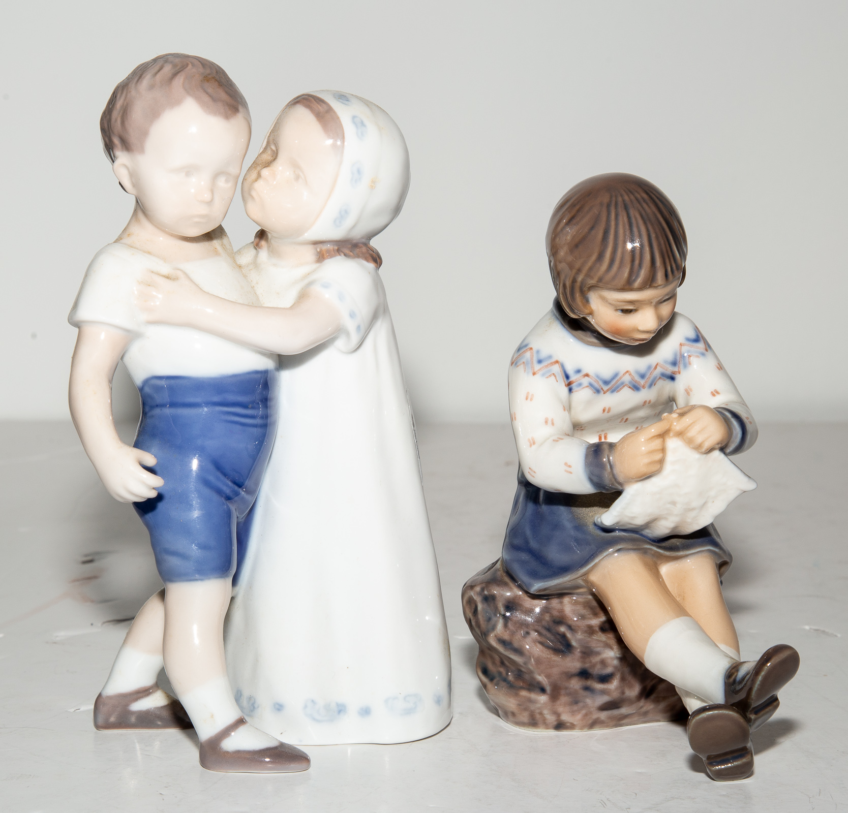 Appraisal: TWO DANISH PORCELAIN FIGURES Comprising a Dahl Jensen Copenhagen Girl