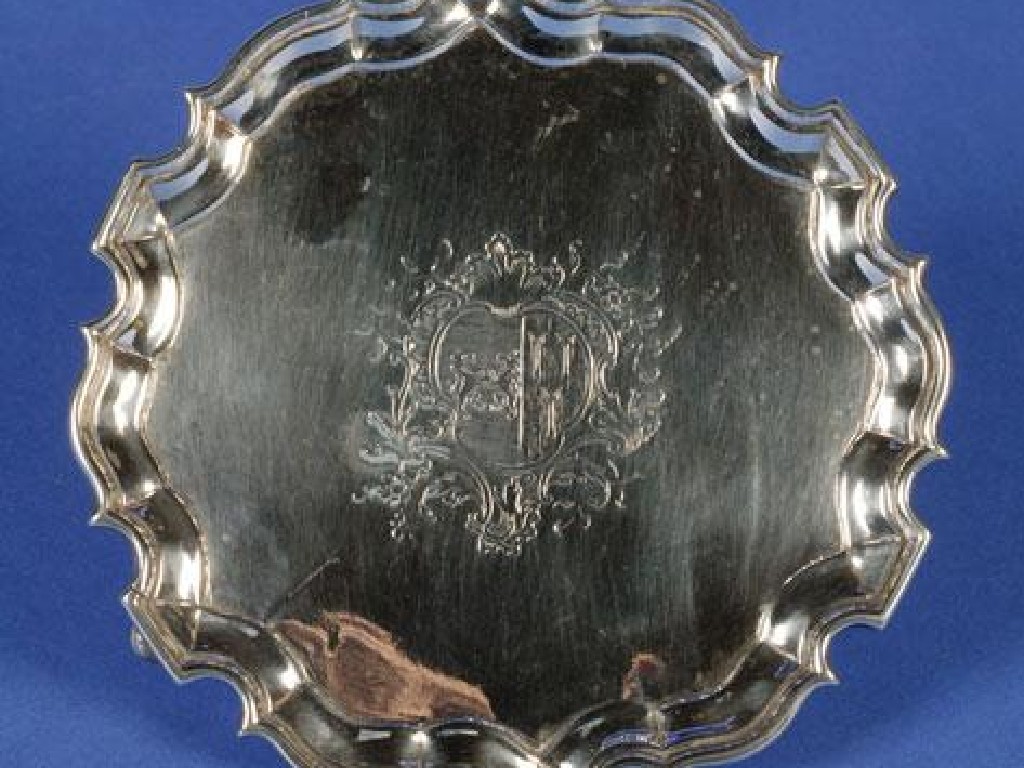 Appraisal: A GEORGE II WAITER of shaped circular form with a