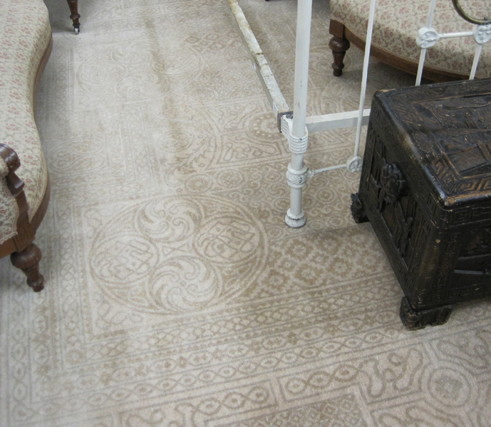 Appraisal: HAND KNOTTED ORIENTAL CARPET featuring an overall geometric design in