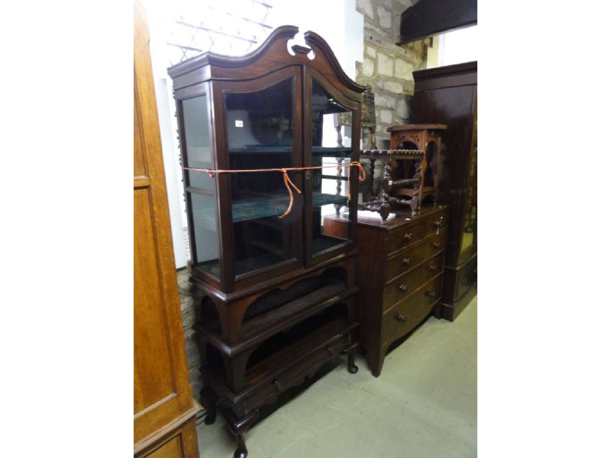 Appraisal: An unusual Edwardian mahogany freestanding side cabinet the upper section