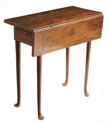 Appraisal: An oak single flap table with an end frieze drawer