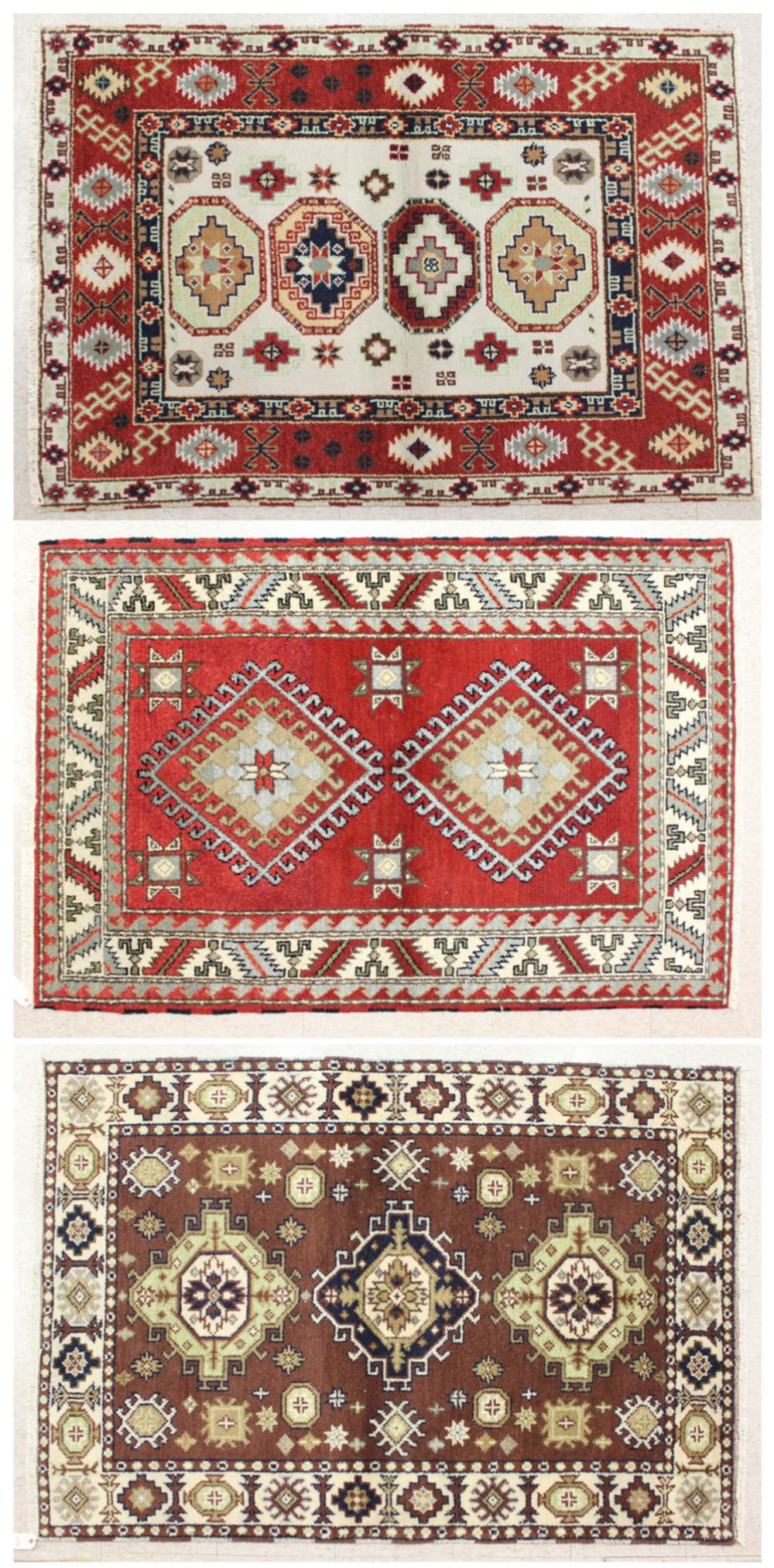 Appraisal: THREE HAND KNOTTED ORIENTAL AREA RUGS Indo-Caucasian tribal designs '