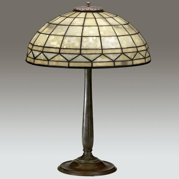 Appraisal: TIFFANY STUDIOS Table lamp with a Colonial geometric shade on