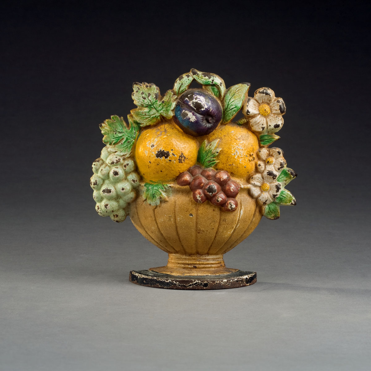 Appraisal: CAST-IRON BASKET OF FRUIT DOORSTOP Height inches