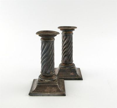 Appraisal: A pair of Victorian silver candlesticks by Martin Hall Co