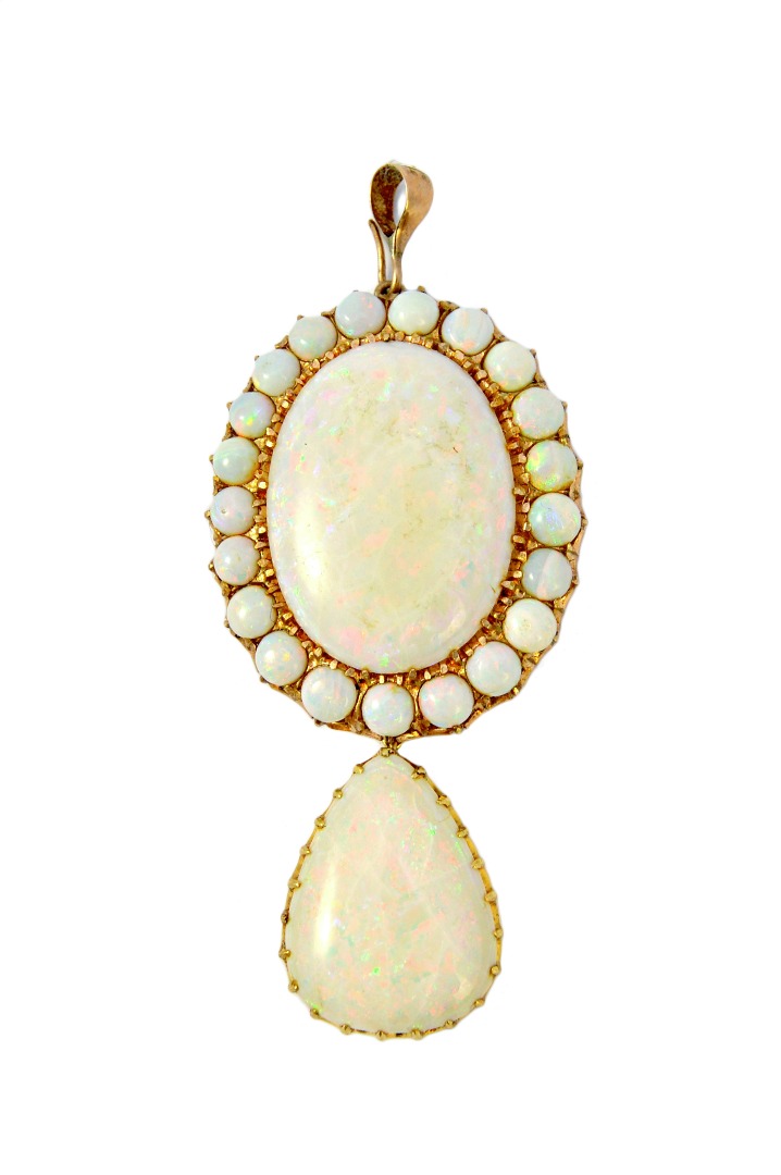 Appraisal: A gold and opal pendant claw set with the principal