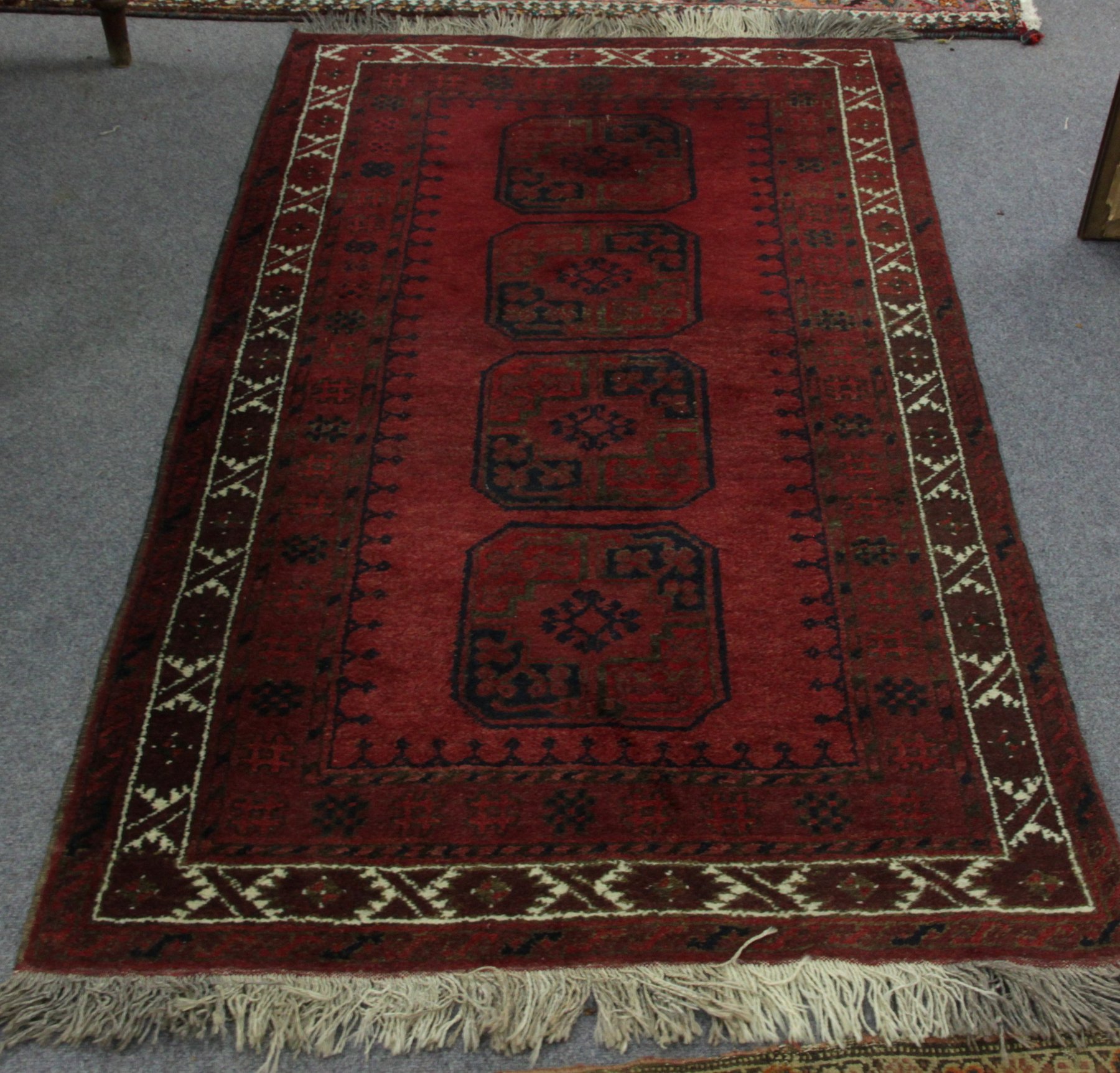 Appraisal: A Boukarah rug with elephant foot guls on a madder