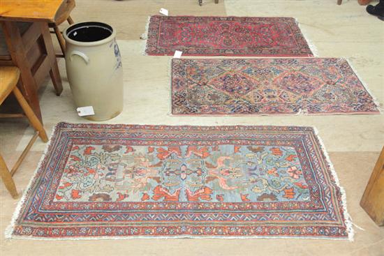 Appraisal: THREE ORIENTAL MATS All with polychrome foliate motifs All approximately