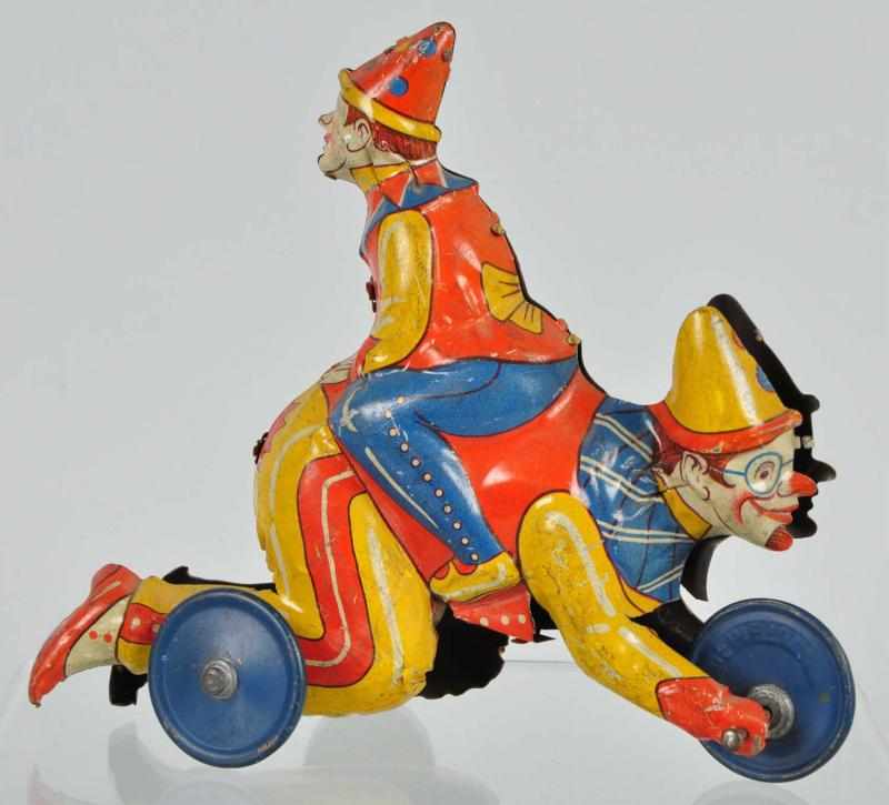 Appraisal: Tin Distler Clown Riding Clown Wind-Up Toy Description German Working