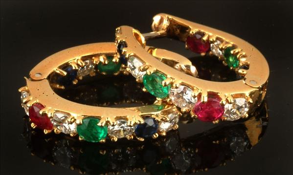 Appraisal: A pair of multi gem set ear hoops alternately set