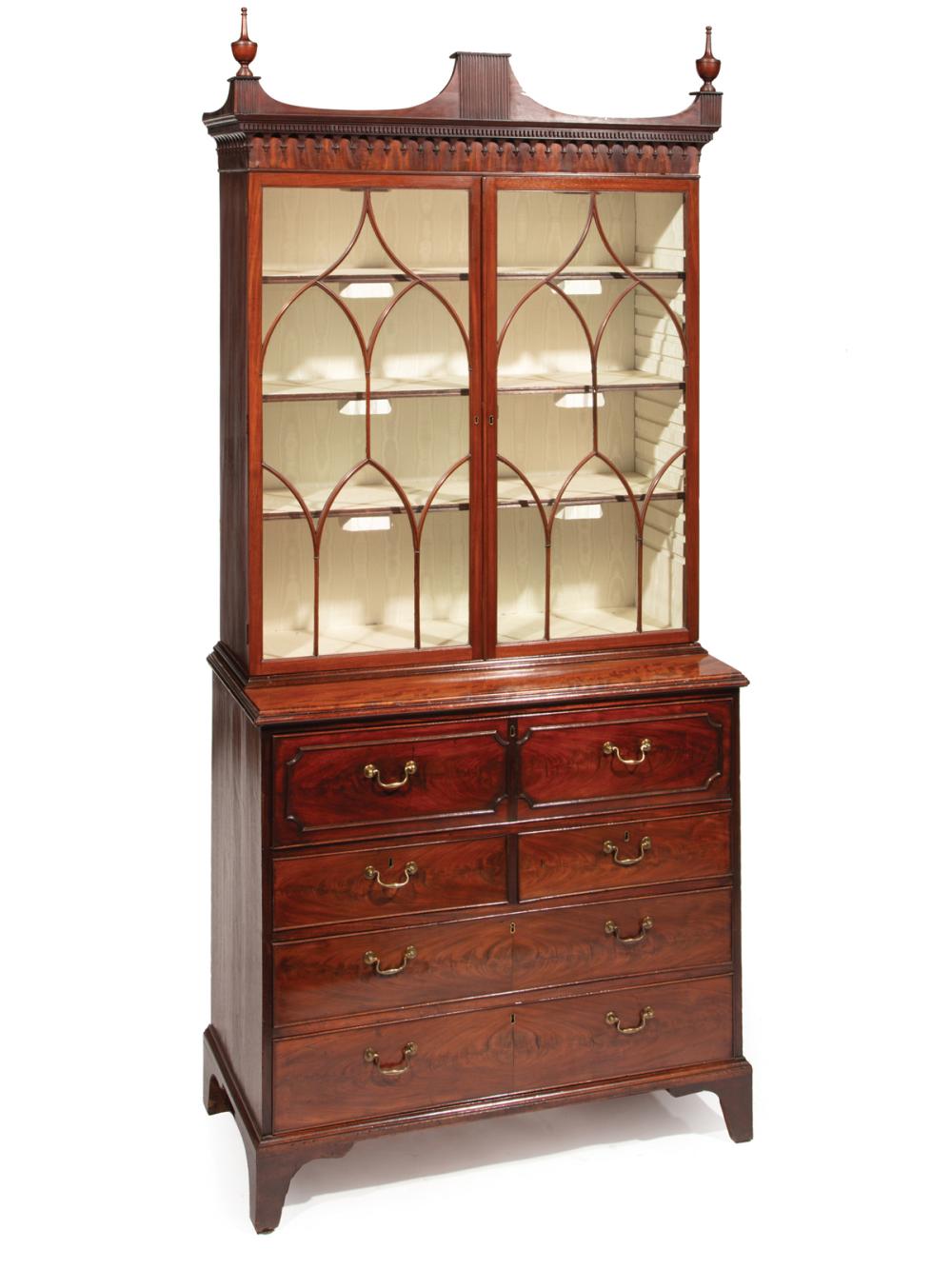 Appraisal: Georgian-Style Mahogany Secretary Bookcase shaped cornice with vasiform finials lancet-carved