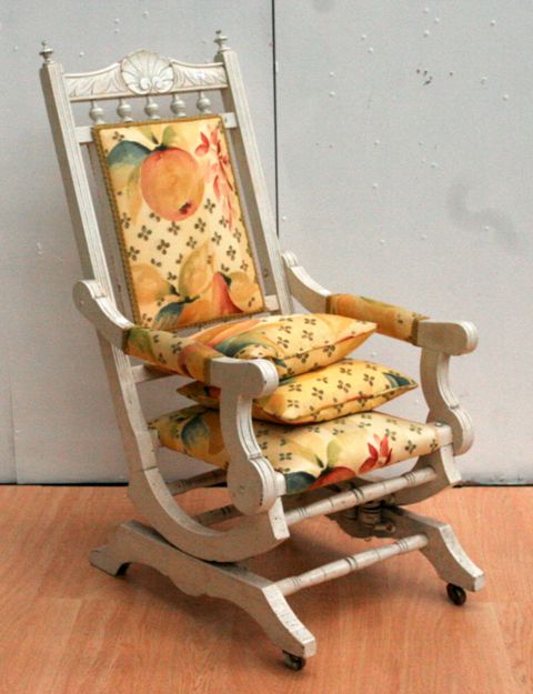 Appraisal: An Edwardian white painted and upholstered rocking chair