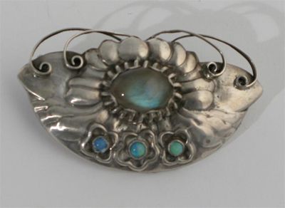 Appraisal: A Georg Jensen silver and moonstone brooch cast in low