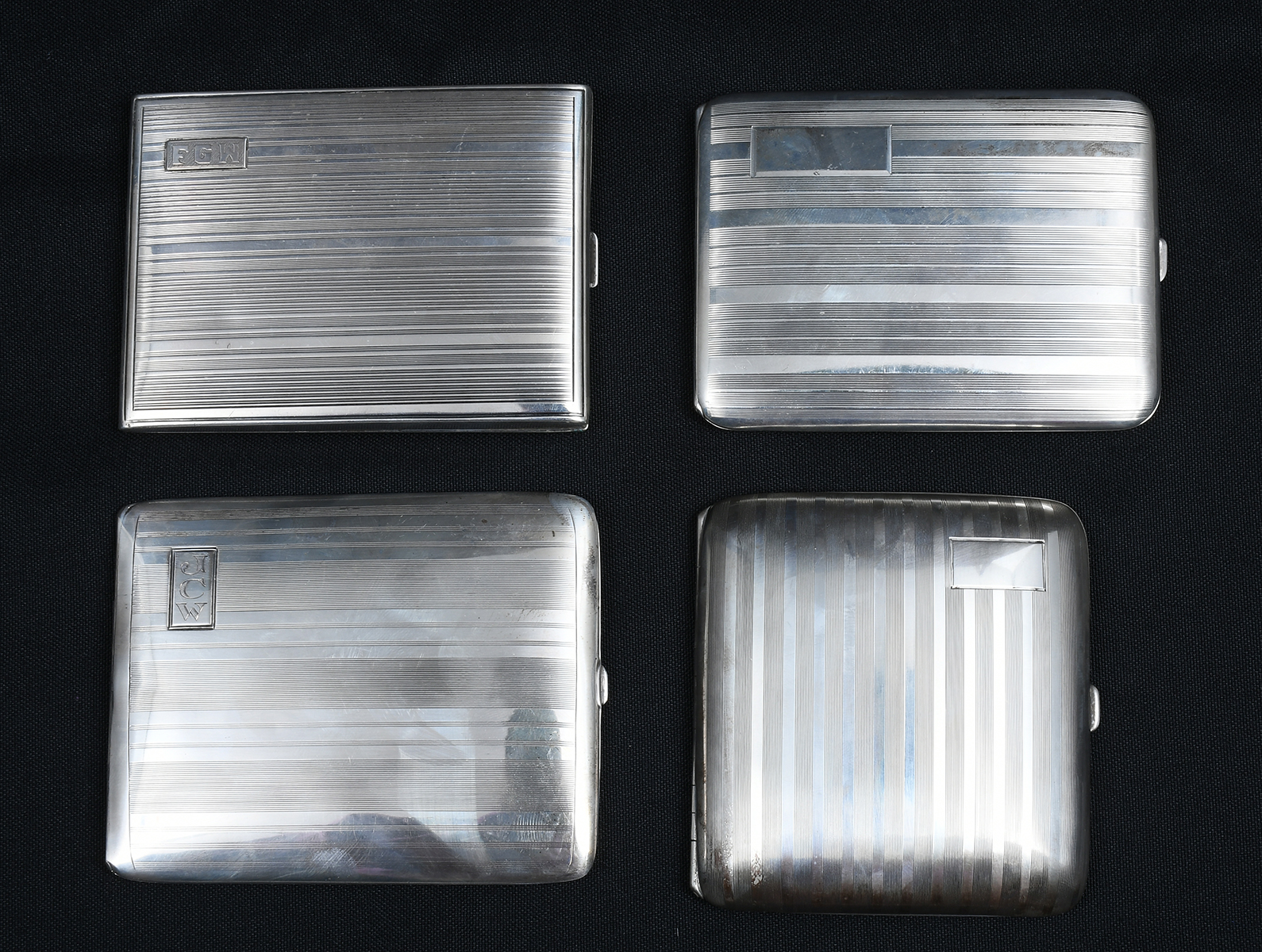 Appraisal: ART DECO STRIPED STERLING CIGARETTE CASES Comprising - Watrous Mfg