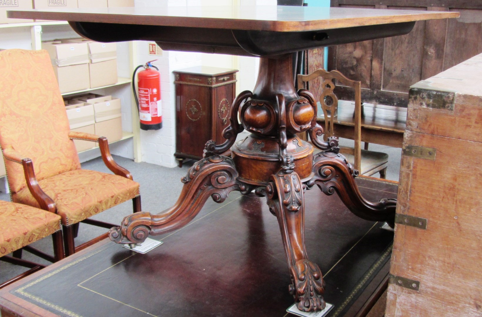 Appraisal: A Victorian mahogany rectangular snap top centre table on four