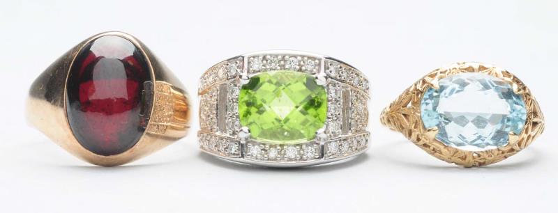 Appraisal: Includes a peridot ring a garnet ring and an aquamarine