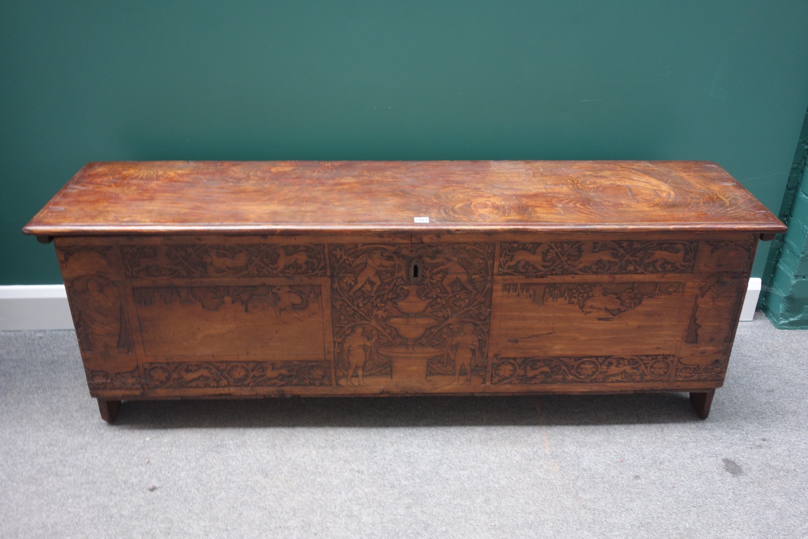 Appraisal: A Cypress chest the rectangular lift top over carved front