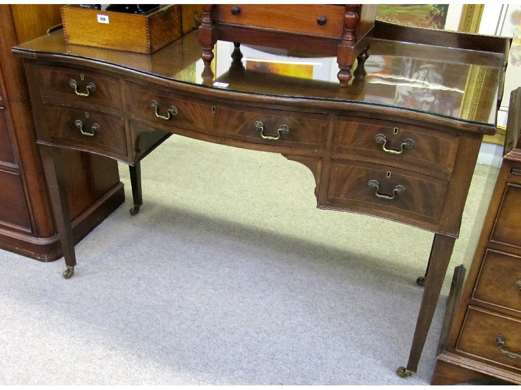 Appraisal: Regency style mahogany serpentine front sideboard