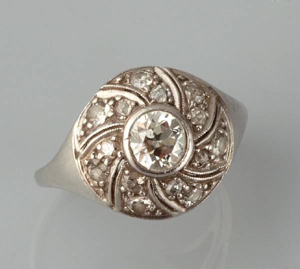 Appraisal: A diamond and platinum scroll ring estimated total diamond weight