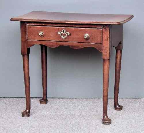 Appraisal: A George II walnut side table the top with moulded