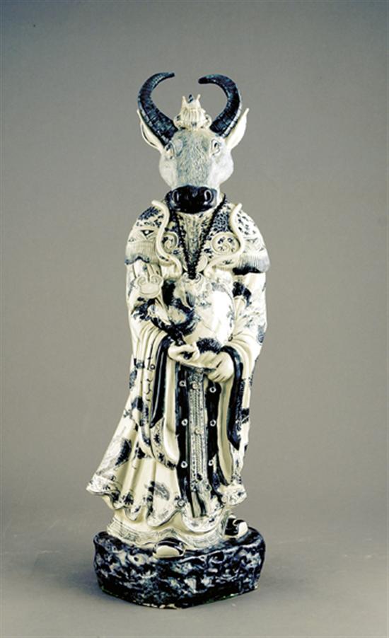 Appraisal: Oriental porcelain figure of a god head of bull body