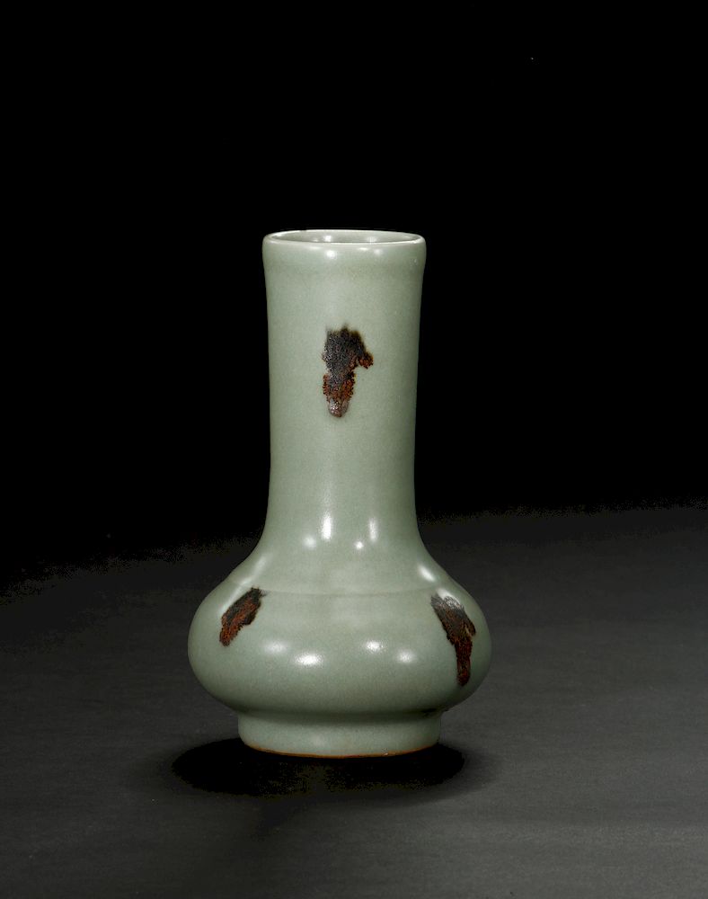 Appraisal: Longquan Celadon Spotted Bottle Vase Of elegant compressed globular body