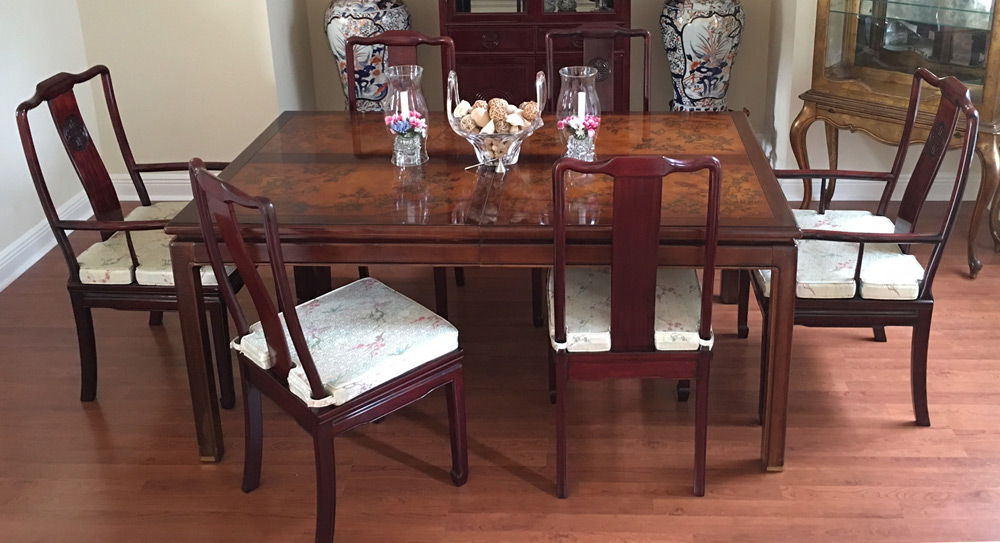 Appraisal: ORIENTAL CARVED TOP DINING TABLE AND CHAIRS Oriental motif table