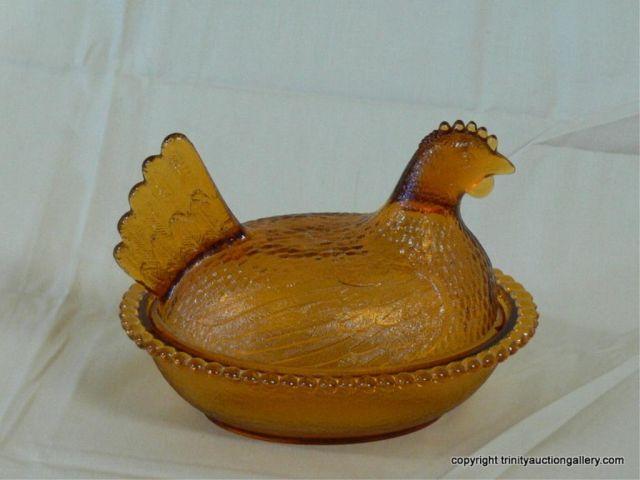 Appraisal: Amber Glass Hen on a Nest Dish - long