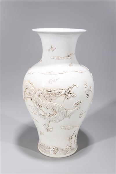 Appraisal: Chinese white glazed molded Qianlong-style dragon vase with dragons chasing