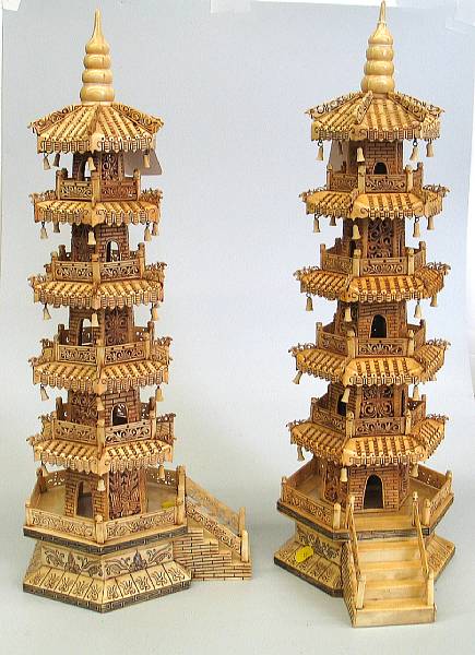 Appraisal: A pair of Asian style carved and stained bone pagodas