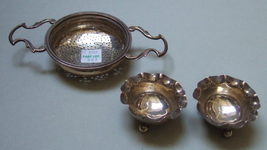 Appraisal: A silver twin handled tea strainer of circular form Birmingham