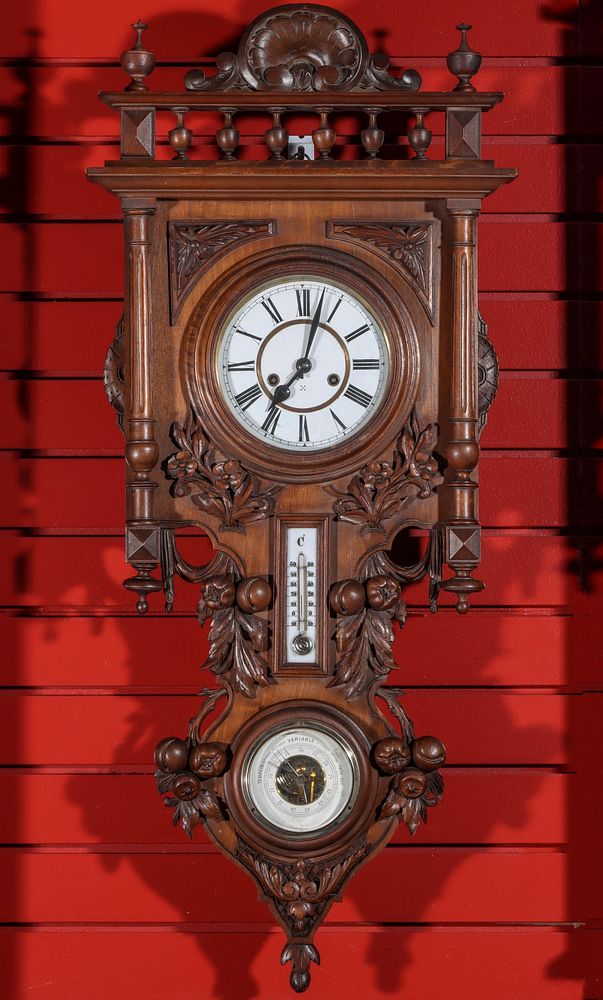 Appraisal: A CARVED WALNUT HAMBURG AMERICAN CLOCK BAROMETER The spindled gallery