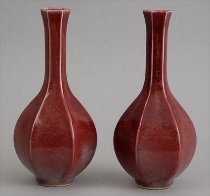 Appraisal: PAIR OF CHINESE SANG DE BOEUF-GLAZED PORCELAIN FOOTED VASES Of