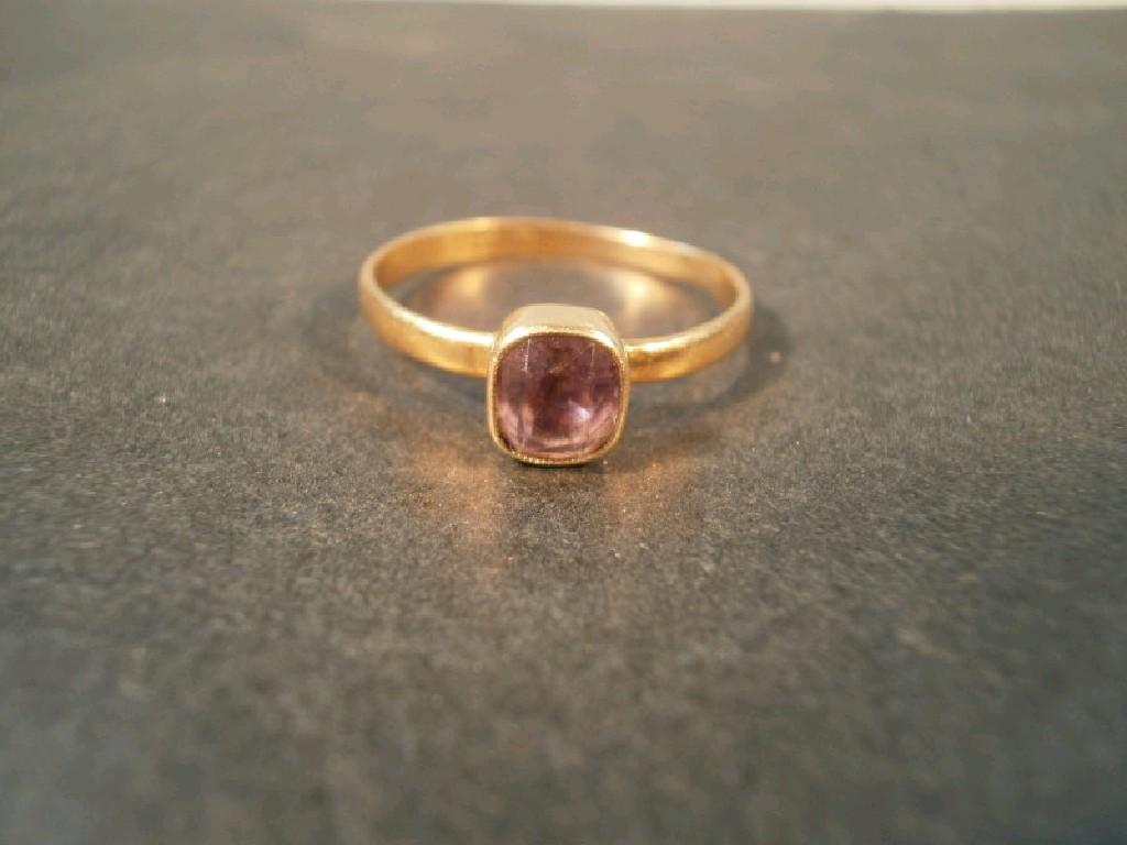 Appraisal: London - an amethyst set dress ring rub over setting