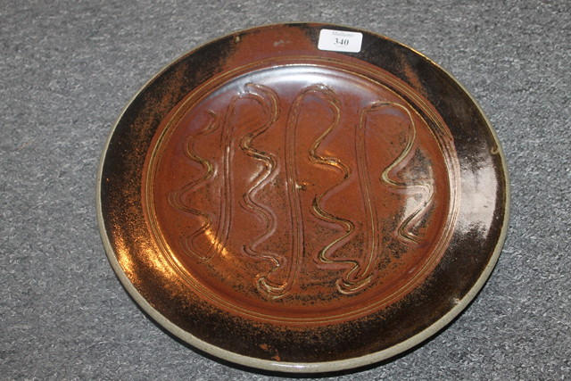 Appraisal: A WINCHCOMBE POTTERY STONEWARE CHARGER with sgraffito design