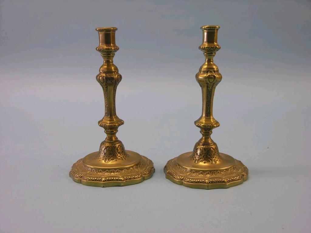 Appraisal: A pair of mid th century French brass candlesticks with