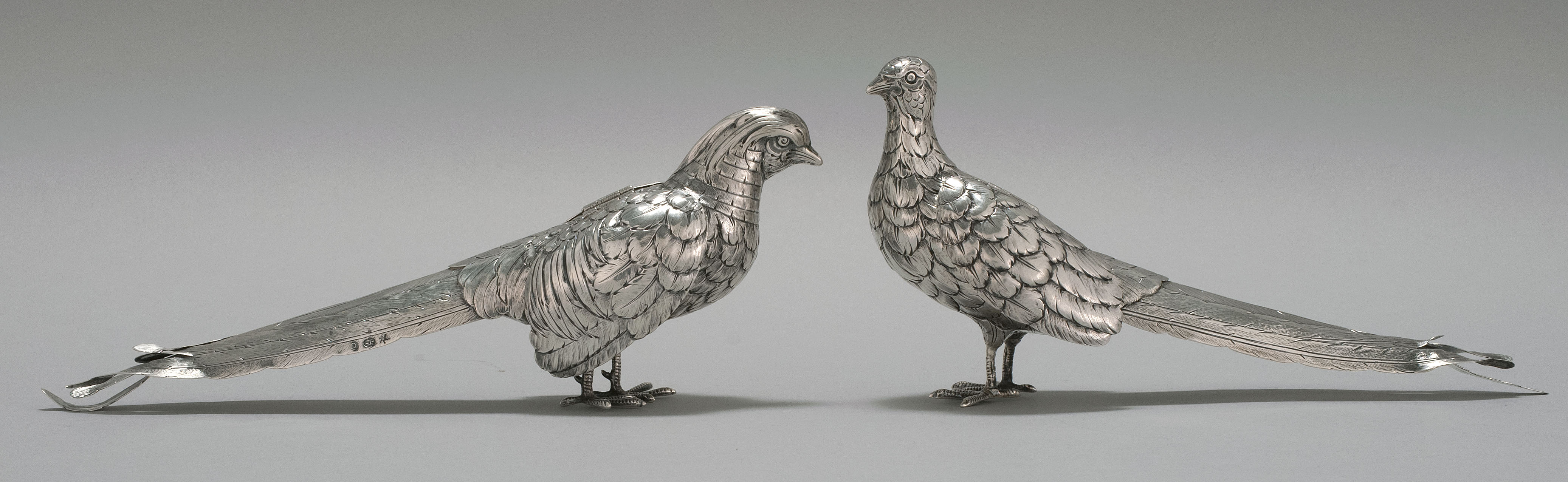 Appraisal: PAIR OF CHINESE SILVER PHEASANTS Maker's marks on tails untraced