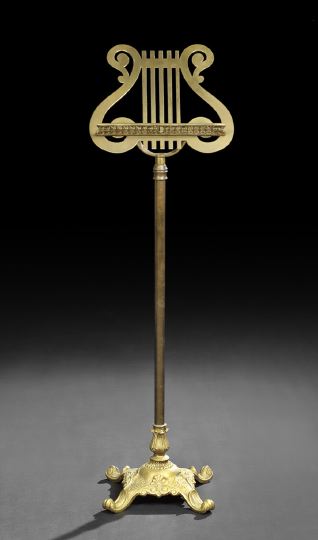 Appraisal: Edwardian Brass and Gilt-Metal Music Stand ca the revolving rack