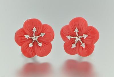 Appraisal: A Pair of Carved Coral Earrings with Diamonds Flower form