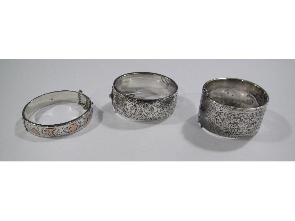 Appraisal: Three engraved silver bangles