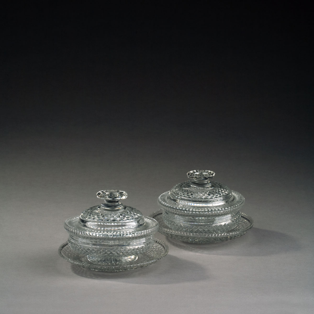 Appraisal: PAIR OF ANGLO-IRISH STYLE CUT GLASS SWEETMEAT BOWLS COVERS AND