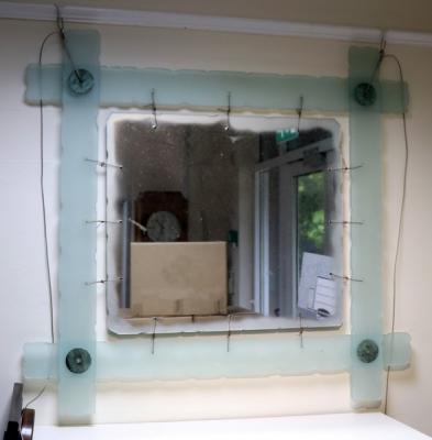 Appraisal: A contemporary frosted glass framed mirror cm x cm