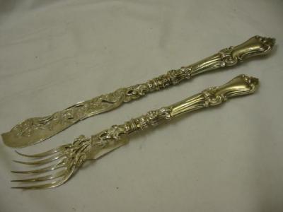 Appraisal: A PAIR OF VICTORIAN FISH SERVERS with pierced leaf engraved