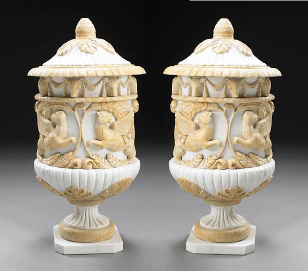 Appraisal: A pair of Neoclassical style covered marble urns height in