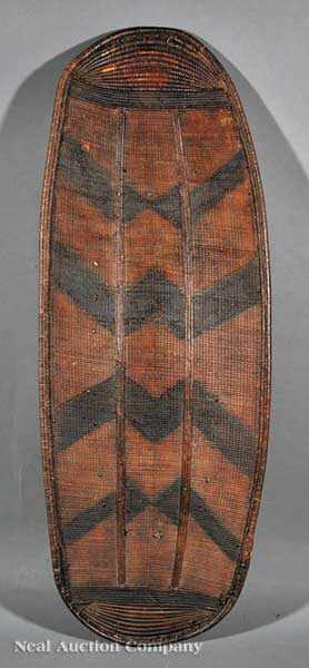 Appraisal: A Nigerian or Cameroon Mambila Painted Wicker Shield the front