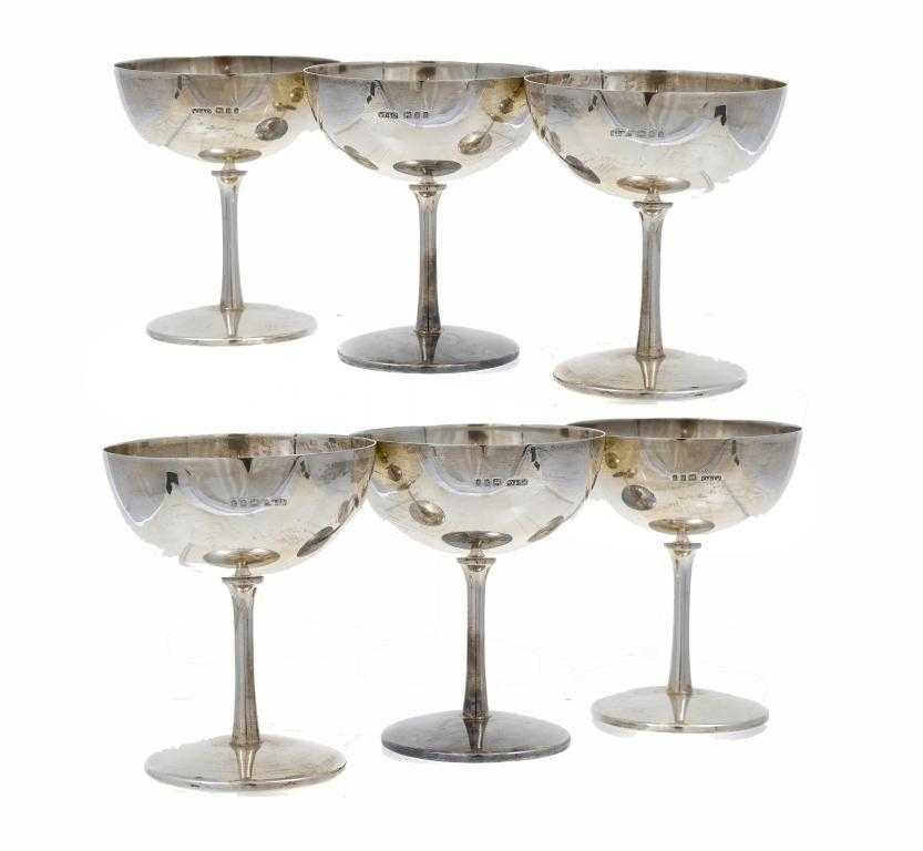 Appraisal: A SET OF SIX GEORGE V CHAMPAGNE SAUCERS with plain